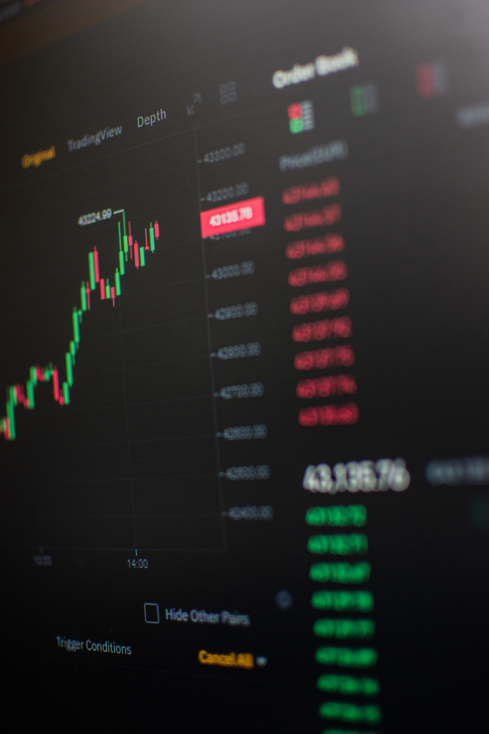 services-04 Close-up view of a cryptocurrency trading screen showing market trends and data.